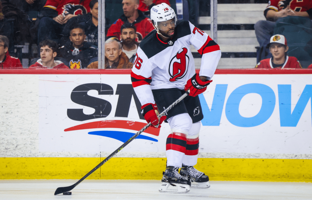 Mar 16, 2022; Calgary, Alberta, CAN; New Jersey Devils defenseman P.K. Subban (76) controls the puck against the Calgary Flames during the first period at Scotiabank Saddledome. Mandatory Credit: Sergei Belski-Imagn Images