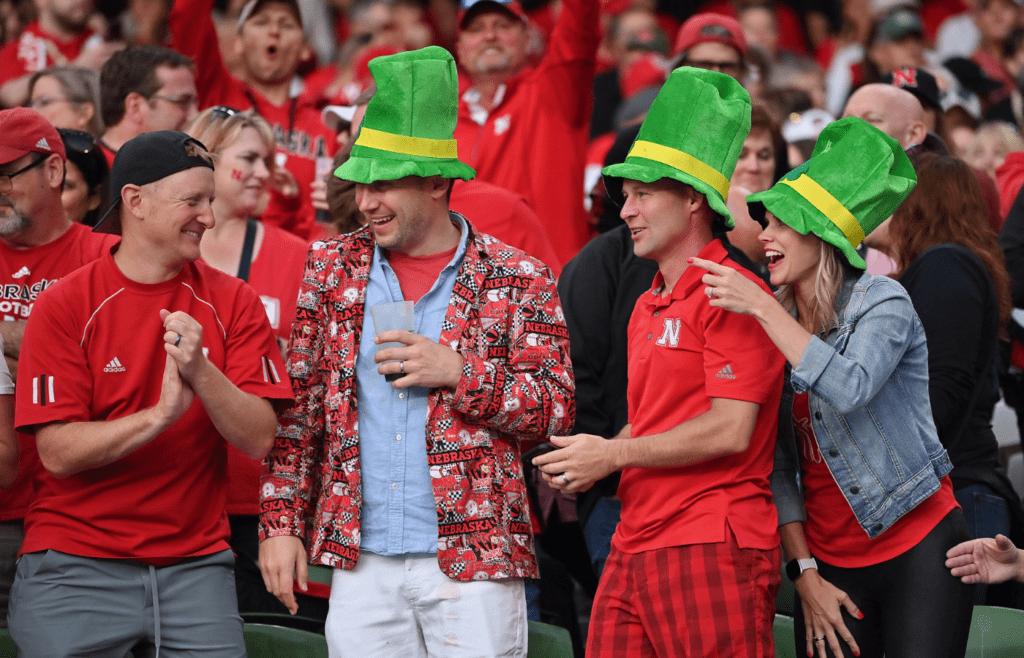 Aug 27, 2022; Dublin, IRELAND; Nebraska Cornhuskers fan cheer against Northwestern during the Aer Lingus college football series at Aviva Stadium. Mandatory Credit: Brendan Moran-Imagn Images