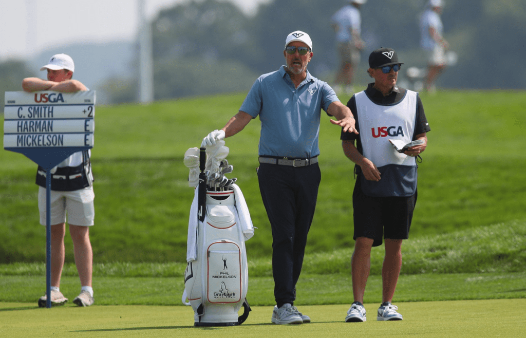 Phil Mickelson talks to his caddie during the 125TH US Open at Oakmont Country Club in Oakmont, PA on June 12, 2025.