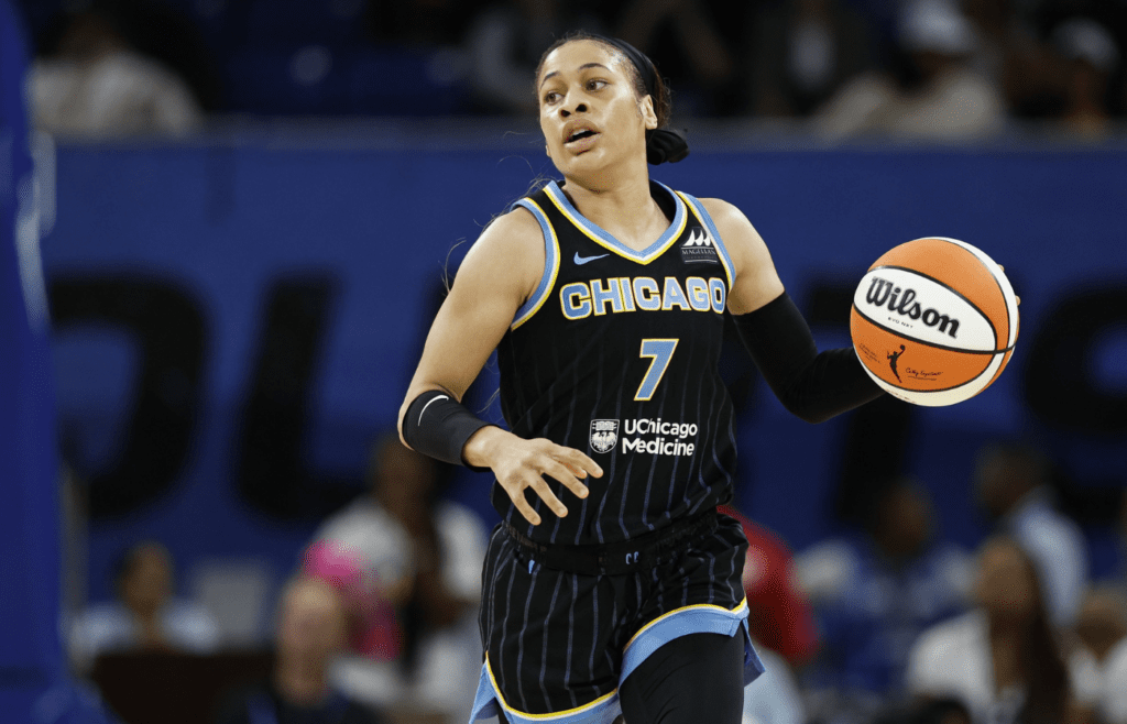 Chicago Sky guard Chennedy Carter (7) brings the ball up court against the Las Vegas Aces during the first half at Wintrust Arena.