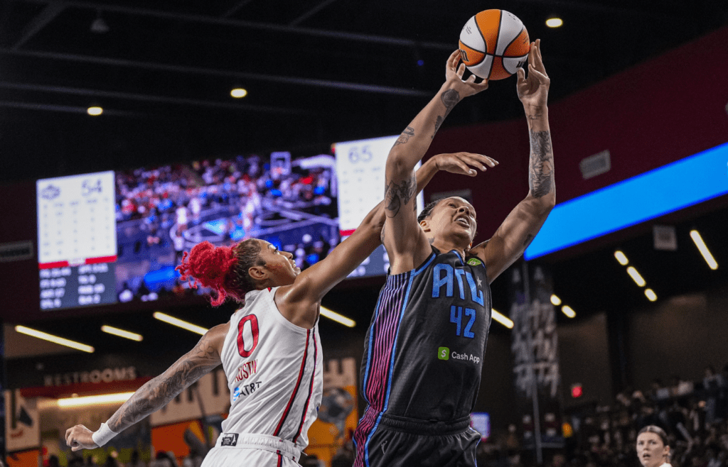 Atlanta Dream center Brittney Griner (42) is fouled by Washington Mystics forward Shakira Austin (0) during the second half at Gateway Center Arena at College Park.
