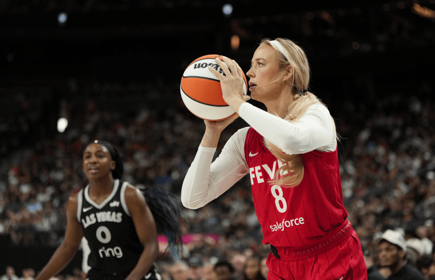 Indiana Fever guard Sophie Cunningham (8) shoots the ball during the second half of a WNBA basketball game against the Las Vegas Aces at T-Mobile Arena.
