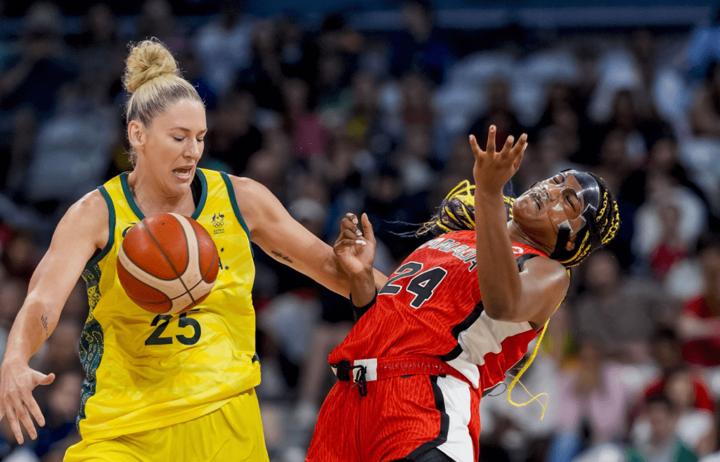 Australia centre Lauren Jackson (25) and Canada forward Aaliyah Edwards (24) battle for the ball during the Paris 2024 Olympic Summer Games at Stade Pierre-Mauroy.
