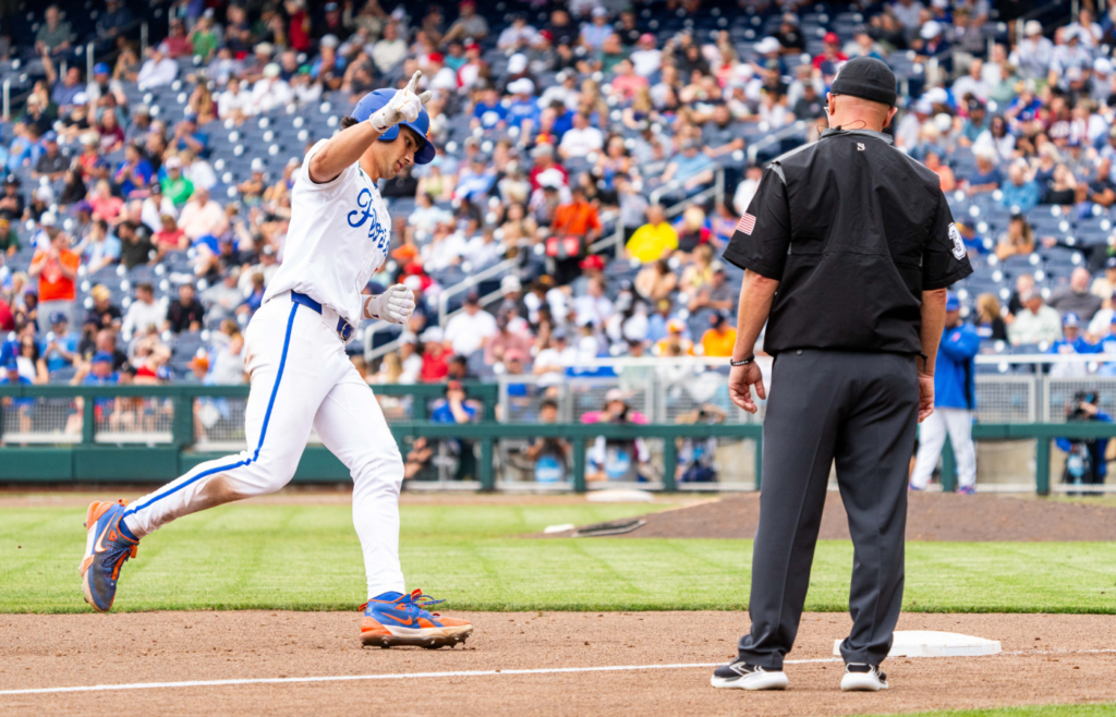 Jun 19, 2024; Omaha, NE, USA; Florida Gators first baseman Jac Caglianone (14) celebrates after hitting a home run against the Kentucky Wildcats during the sixth inning at Charles Schwab Field Omaha. The 75th home run of his career, Caglianone breaks the Florida all-time home run record previously held by Matt LaPorta. Mandatory Credit: Dylan Widger-Imagn Images