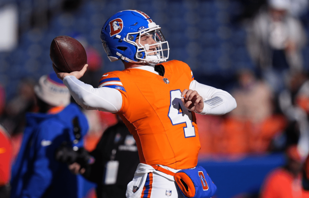 Denver Broncos quarterback Zach Wilson (4) before the game against the Kansas City Chiefs at Empower Field at Mile High.
