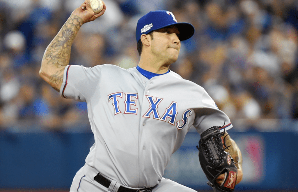 Texas Rangers relief pitcher Matt Bush throws a pitch against the Toronto Blue Jays in the 8th inning during game three of the 2016 ALDS playoff baseball series at Rogers Centre.