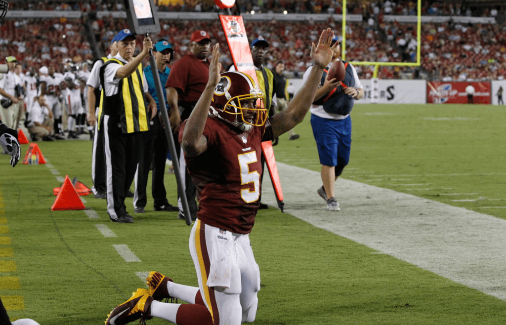 Aug 29, 2013; Tampa, FL, USA; Washington Redskins quarterback Pat White (5) reacts after scoring a touchdown during the first half against the Tampa Bay Buccaneers at Raymond James Stadium. Mandatory Credit: Kim Klement-Imagn Images