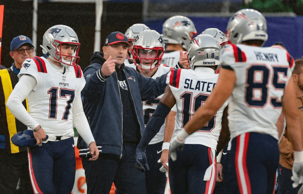 Nov 26, 2023; East Rutherford, New Jersey, USA; New England Patriots assistant head coach Joe Judge talks with players during the second half against the New York Giants at MetLife Stadium. Mandatory Credit: Vincent Carchietta-Imagn Images