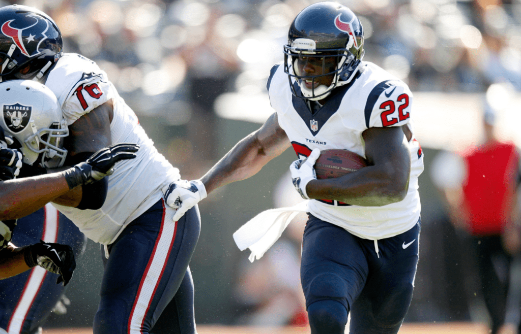 Sep 14, 2014; Oakland, CA, USA; Houston Texans running back Ronnie Brown (22) runs the ball against the Oakland Raiders in the fourth quarter at O.co Coliseum. The Texans defeated the Raiders 30-14. Mandatory Credit: Cary Edmondson-Imagn Images