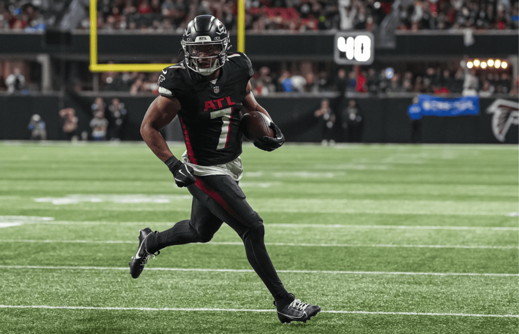 Jan 5, 2025; Atlanta, Georgia, USA; Atlanta Falcons running back Bijan Robinson (7) runs for a touchdown against the Carolina Panthers during the second half at Mercedes-Benz Stadium. Mandatory Credit: Dale Zanine-Imagn Images