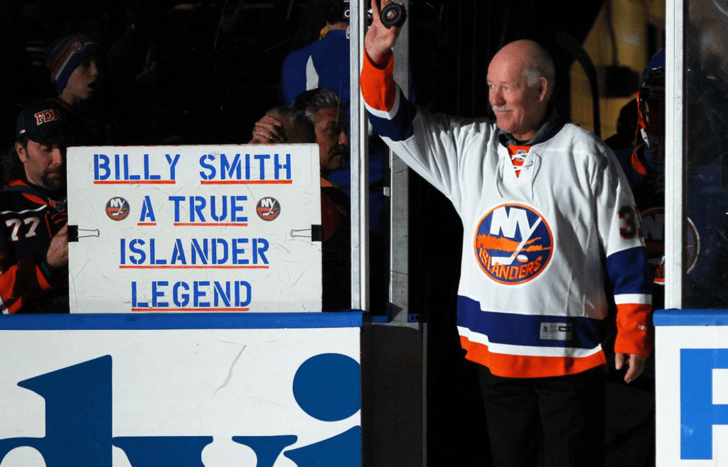 Nov 22, 2014; Uniondale, NY, USA; Former New York Islanders goaltender Billy Smith (R) leads the players onto the ice prior to the Islanders ' game against the Pittsburgh Penguins at Nassau Veterans Memorial Coliseum. Mandatory Credit: Andy Marlin-Imagn Images