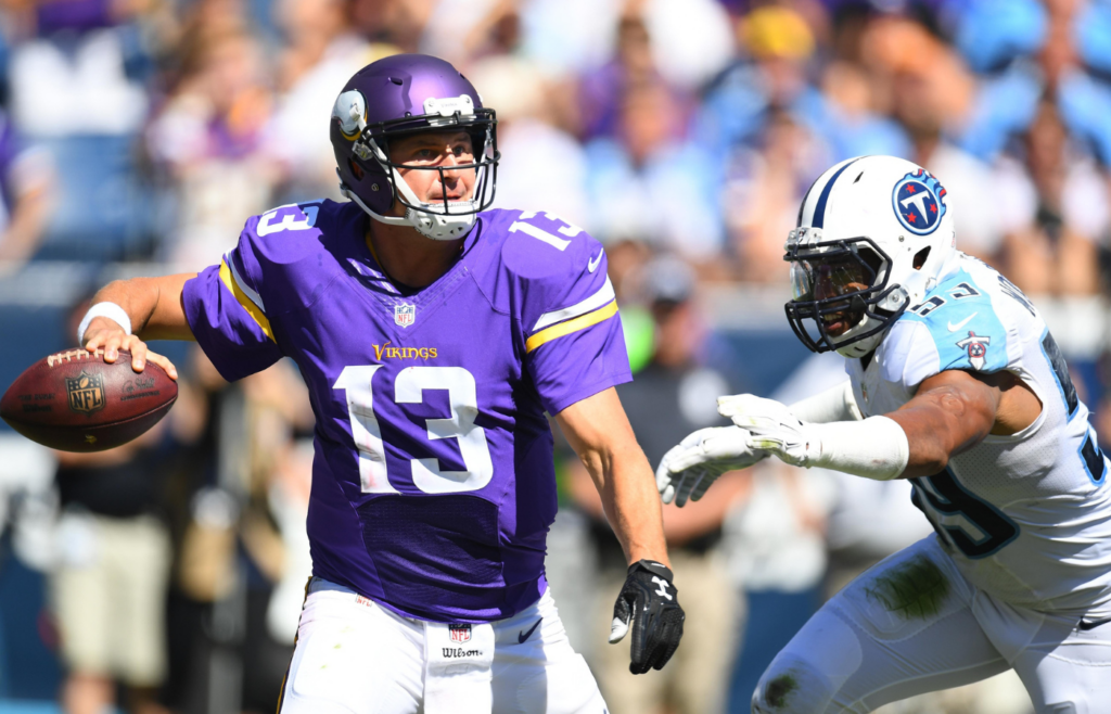 Sep 11, 2016; Nashville, TN, USA; Minnesota Vikings quarterback Shaun Hill (13) passes the ball with pressure from Tennessee Titans linebacker Wesley Woodyard (59) at Nissan Stadium. The Vikings won 25-16. Mandatory Credit: Christopher Hanewinckel-Imagn Images