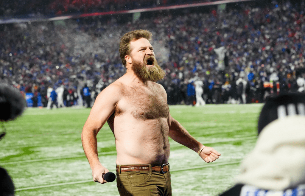 Jan 19, 2025; Orchard Park, New York, USA; Former Buffalo Bills quarterback Ryan Fitzpatrick rallies the crowd before the game against the Baltimore Ravens in a 2025 AFC divisional round game at Highmark Stadium. Mandatory Credit: Gregory Fisher-Imagn Images