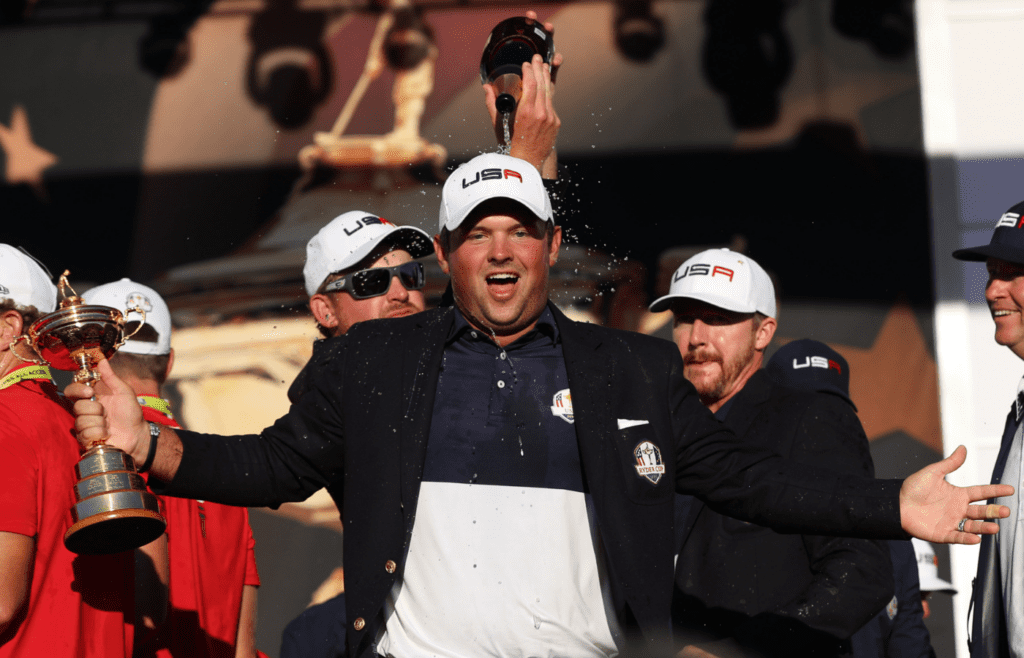 Oct 2, 2016; Chaska, MN, USA; Patrick Reed of the United States celebrates during the closing ceremonies after the single matches in 41st Ryder Cup at Hazeltine National Golf Club. Mandatory Credit: Rob Schumacher-Imagn Images