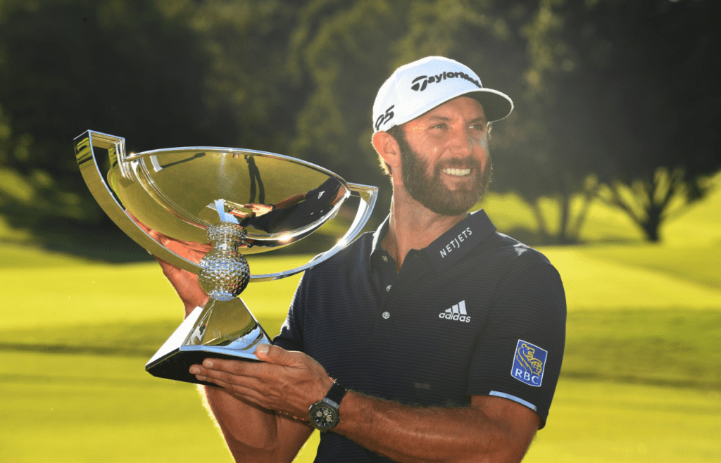 Sep 7, 2020; Atlanta, Georgia, USA; Dustin Johnson with the FedEx Cup trophy after the final round of the Tour Championship golf tournament at East Lake Golf Club. Mandatory Credit: Adam Hagy-Imagn Images