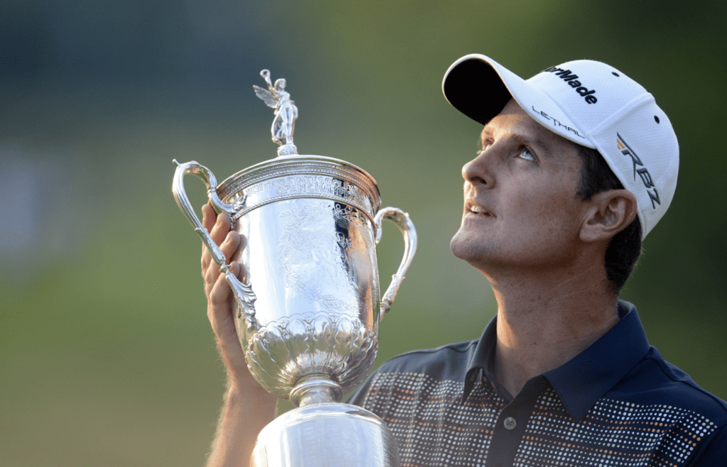 Jun 16, 2013; Ardmore, PA, USA; Justin Rose celebrates with the championship trophy after the final round of the 113th U.S. Open golf tournament at Merion Golf Club. Mandatory Credit: John David Mercer-Imagn Images