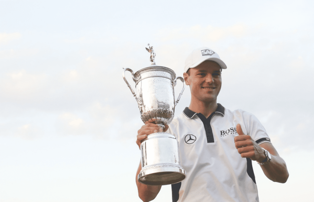 Jun 15, 2014; Pinehurst, NC, USA; Martin Kaymer celebrates with the trophy during the final round of the 2014 U.S. Open golf tournament at Pinehurst Resort Country Club - #2 Course. Mandatory Credit: Jason Getz-Imagn Images
