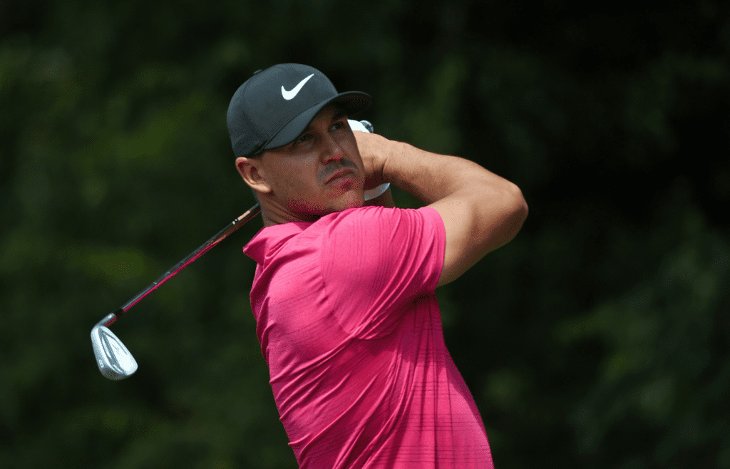 Sep 21, 2018; Atlanta, GA, USA; Brooks Koepka tees off on the second hole during the second round of the Tour Championship golf tournament at East Lake Golf Club. Mandatory Credit: John David Mercer-Imagn Images