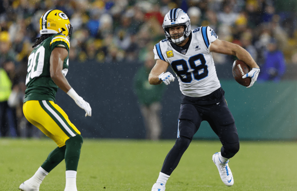 Carolina Panthers tight end Greg Olsen (88) runs the football after catching a pass against Green Bay Packers cornerback Kevin King (20) during the second quarter at Lambeau Field.