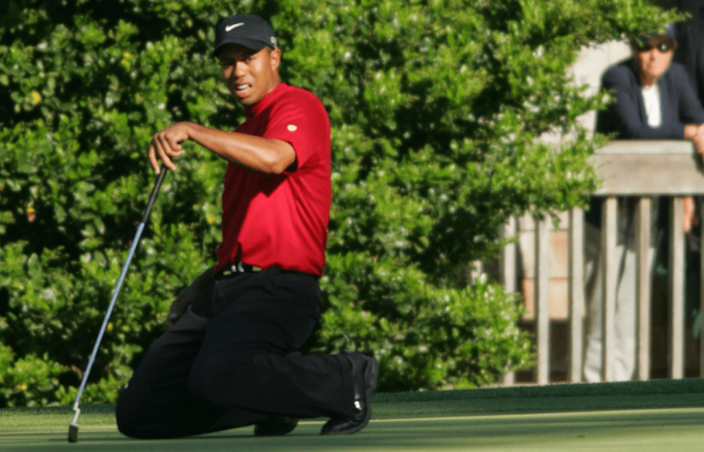 April 10, 2005; Augusta, GA, USA; Tiger Woods goes to his knees as he misses a putt on 11. Mandatory Credit: Jack Gruber/USA TODAY