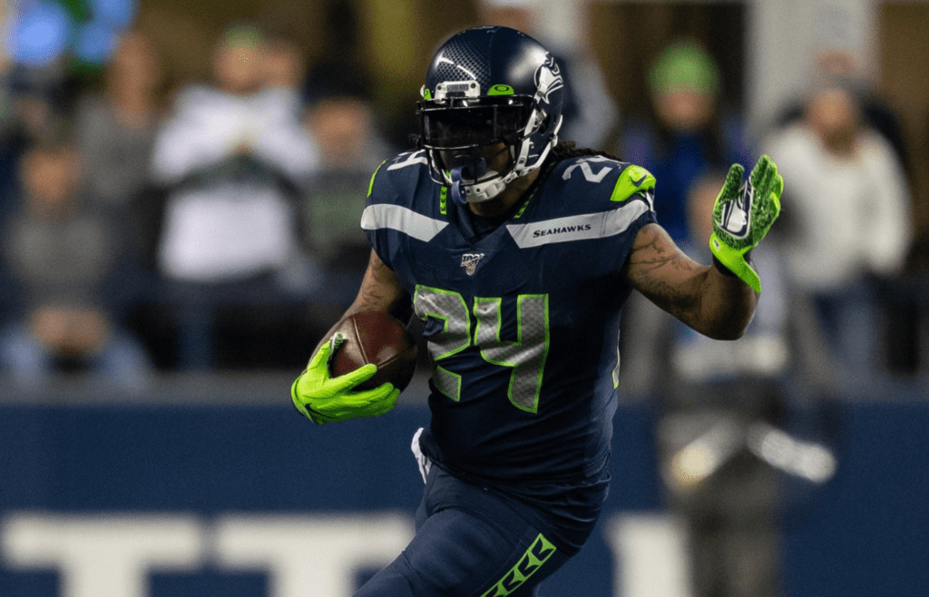 Dec 29, 2019; Seattle, Washington, USA; Seattle Seahawks running back Marshawn Lynch (24) carries the ball against the San Francisco 49ers during the second half at CenturyLink Field. San Francisco defeated Seattle 26-21. Mandatory Credit: Steven Bisig-Imagn Images
