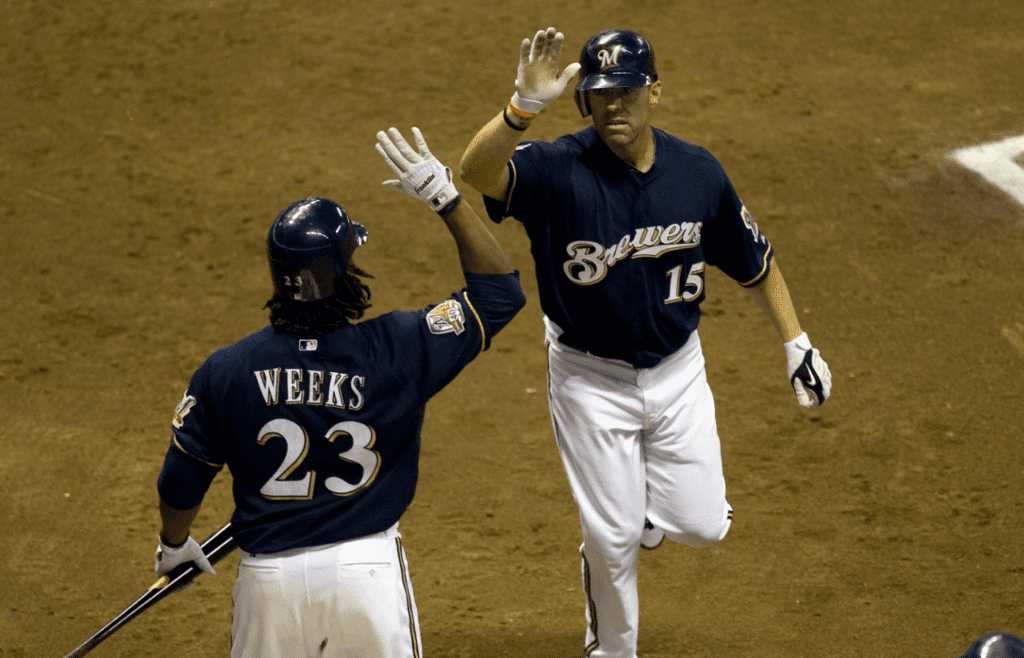 Jim Edmonds high fives second baseman Rickie Weeks
