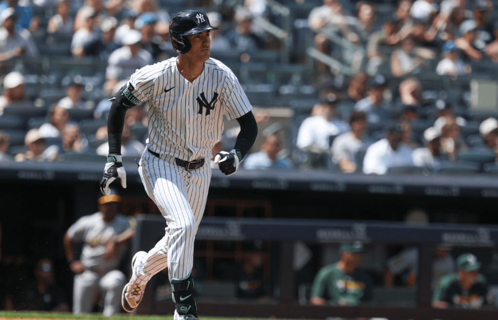 Jun 29, 2025; Bronx, New York, USA; New York Yankees right fielder Cody Bellinger (35) doubles during the fourth inning against the Athletics at Yankee Stadium. Mandatory Credit: Vincent Carchietta-Imagn Images