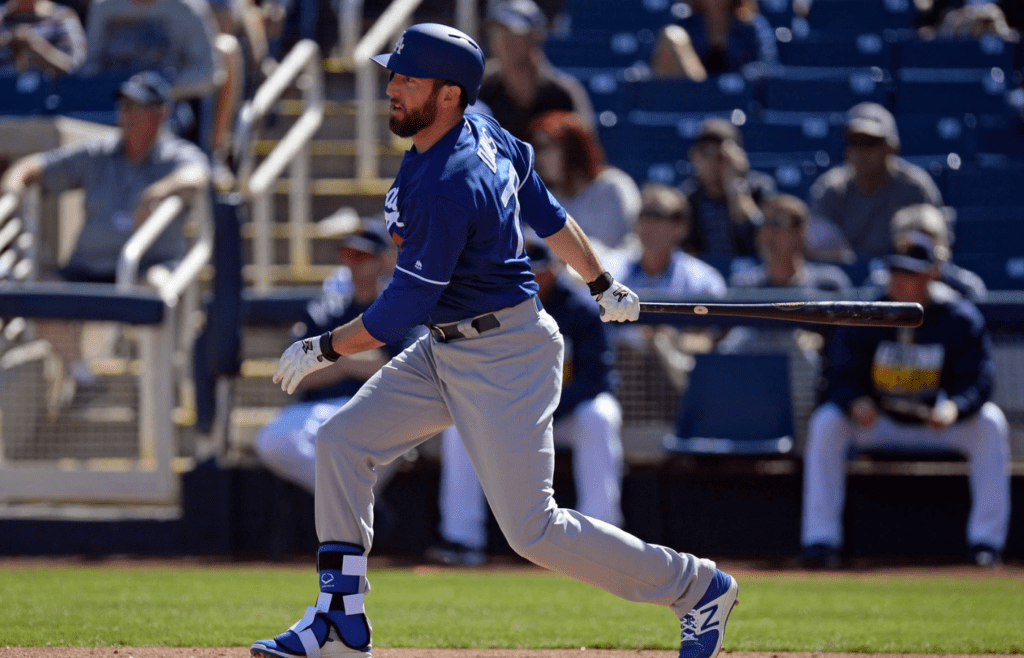 Feb 26, 2017; Phoenix, AZ, USA; Los Angeles Dodgers first baseman Ike Davis (77) hits a single against the Milwaukee Brewers in the third inning at Maryvale Baseball Park. Mandatory Credit: Joe Camporeale-Imagn Images