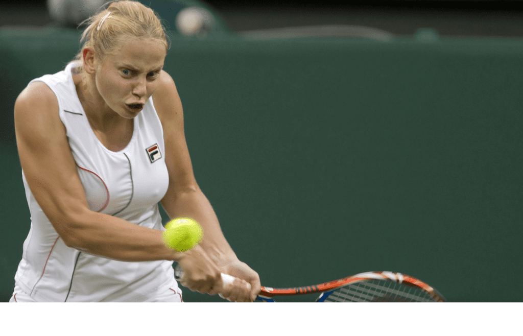 June 20, 2011; London, UNITED KINGDOM; Jelena Dokic (AUS) returns a shot against Francesca Schiavone (ITA) on day one of the 2011 Wimbledon Championships at the All England Lawn Tennis Club. Mandatory Credit: Susan Mullane-Imagn Images
