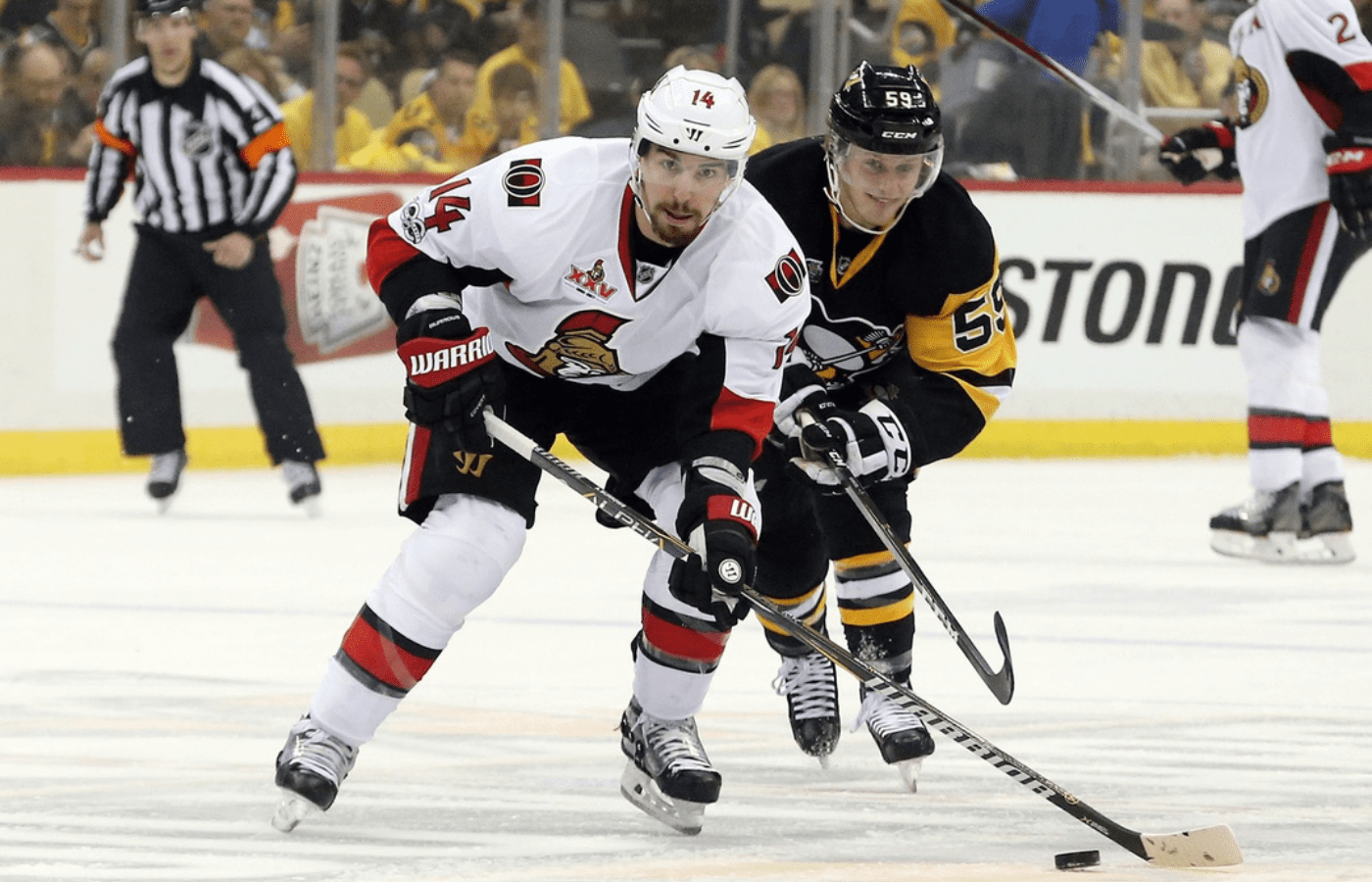 May 13, 2017; Pittsburgh, PA, USA; Ottawa Senators left wing Alex Burrows (14) controls the puck as Pittsburgh Penguins center Jake Guentzel (59) defends during the first period in game one of the Eastern Conference Final of the 2017 Stanley Cup Playoffs at PPG PAINTS Arena. Mandatory Credit: Charles LeClaire-Imagn Images