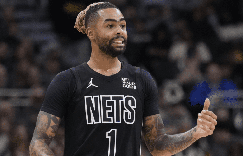 Jan 2, 2025; Milwaukee, Wisconsin, USA; Brooklyn Nets guard D’Angelo Russell (1) brings the ball up the court against the Milwaukee Bucks in the second half at Fiserv Forum. Mandatory Credit: Michael McLoone-Imagn Images