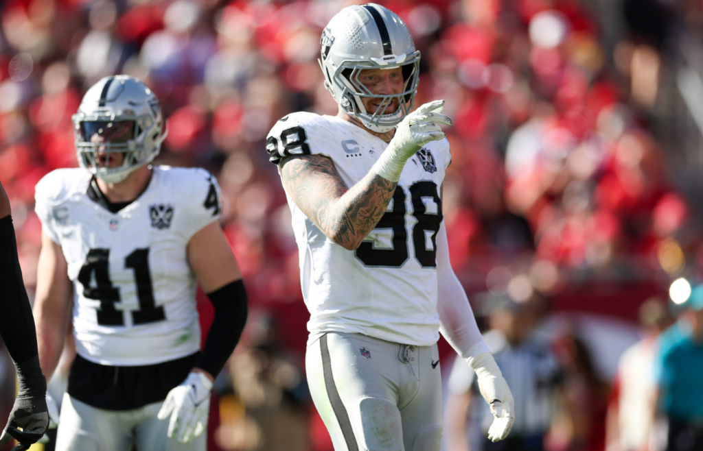Dec 8, 2024; Tampa, Florida, USA; Las Vegas Raiders defensive end Maxx Crosby (98) celebrates after a sack against the Tampa Bay Buccaneers in the second quarter at Raymond James Stadium. Mandatory Credit: Nathan Ray Seebeck-Imagn Images