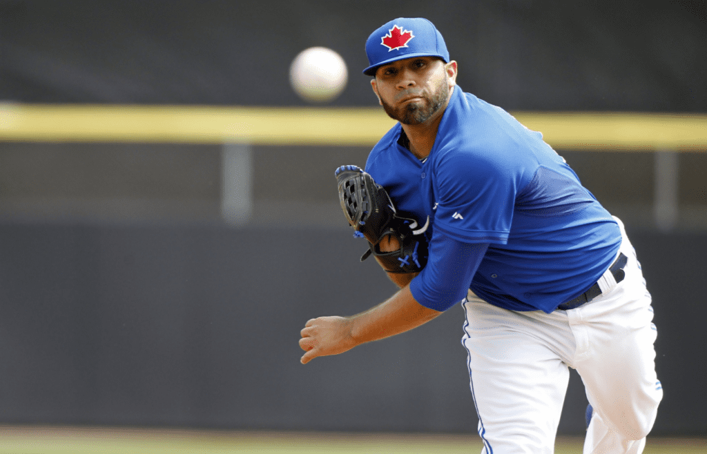 Mar 12, 2014; Dunedin, FL, USA; Toronto Blue Jays starting pitcher Ricky Romero (24) throws a pitch during the sixth inning against the Tampa Bay Rays at Florida Auto Exchange Park. Mandatory Credit: Kim Klement-Imagn Images