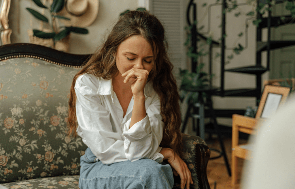 Tired woman sitting alone, hiding real feelings