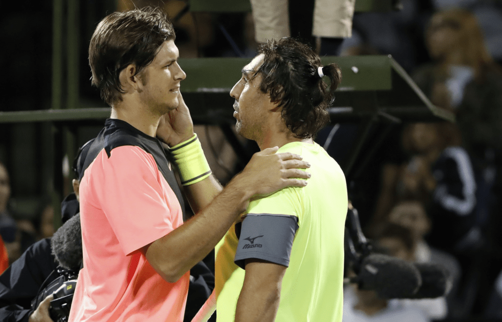Mar 21, 2018; Key Biscayne, FL, USA; Jared Donaldson of the United States (L) is congratulated by Marcos Baghdatis of Cyprus (R) after their match on day two of the Miami Open at Tennis Center at Crandon Park. Donaldson won 6-3, 6-4. Mandatory Credit: Geoff Burke-Imagn Images