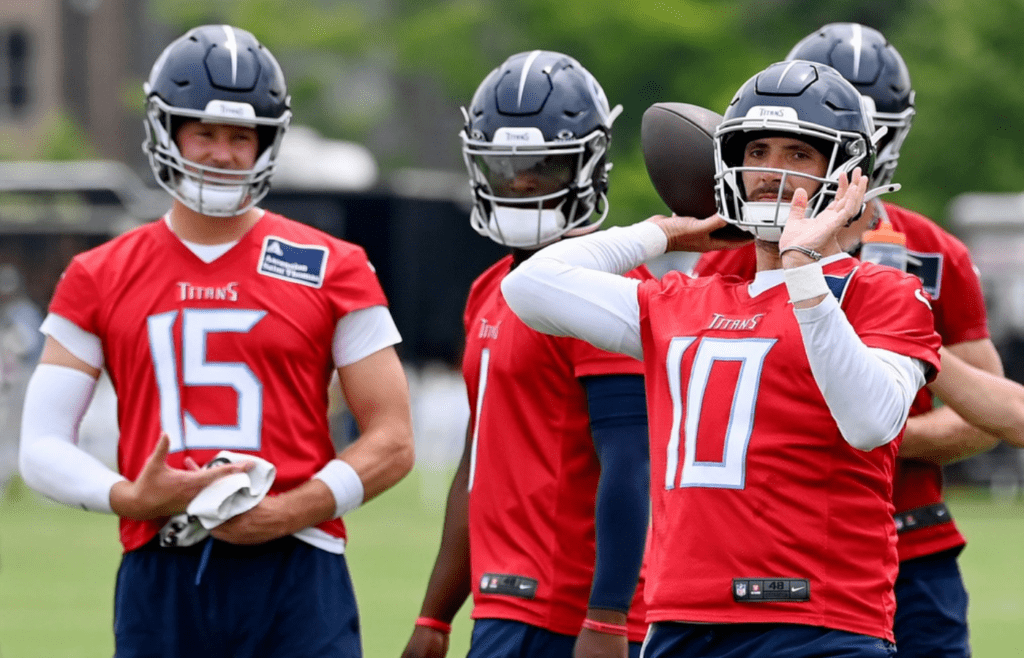 Tennessee Titans quarterback Brandon Allen (10) passes as Tim Boyle (15) and Cam Ward (1) watch during an NFL football minicamp camp practice at Ascension Saint Thomas Sports Park Thursday, June 12, 2025, in Nashville, Tenn
