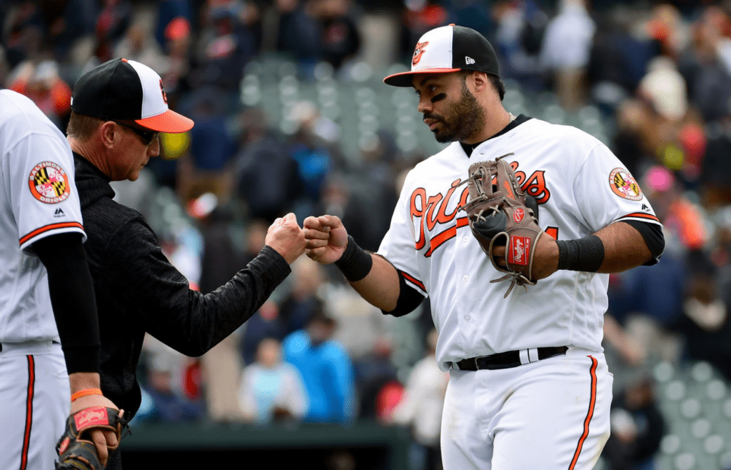Apr 29, 2018; Baltimore, MD, USA; Baltimore Orioles third baseman Pedro Alvarez (24) high fives teammates after beating the Detroit Tigers 5-3 at Oriole Park at Camden Yards. Mandatory Credit: Evan Habeeb-Imagn Images
