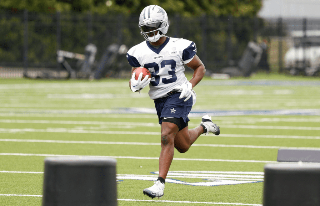 Jun 10, 2025; Arlington, TX, USA; Dallas Cowboys running back Javonte Williams (33) goes through a drill during practice at the Ford Center at the Star Training Facility in Frisco, Texas. Mandatory Credit: Chris Jones-Imagn Images