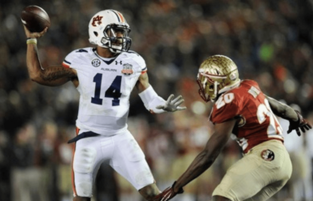 Auburn quarterback Nick Marshall (14) gets a pass away while defended by Florida State defenscive back Lamarcus Joyner (20) in second half action of the BCS National Championship Game on Monday January 6, 2014 in Pasadena, Ca.