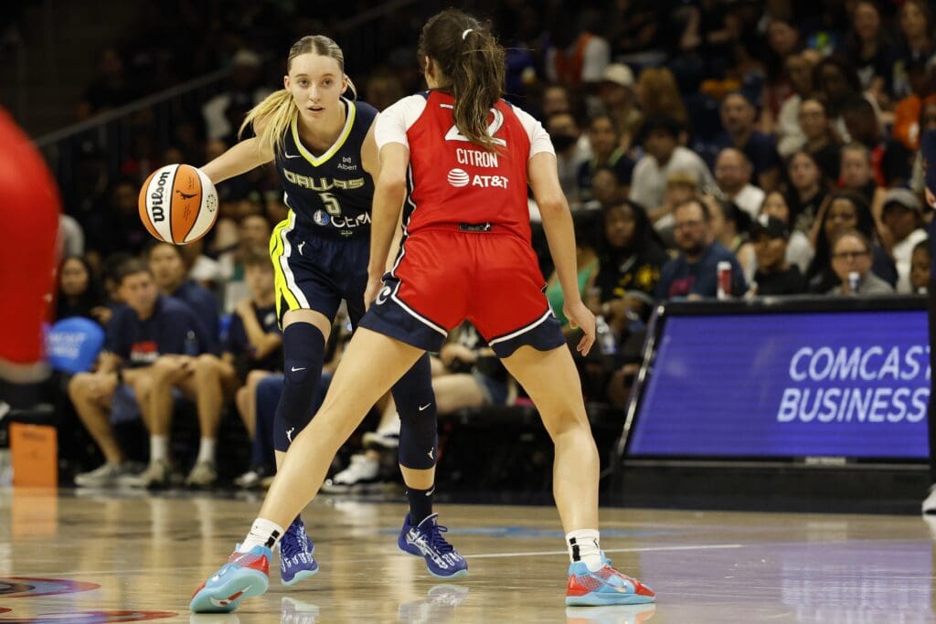 Jun 22, 2025; Washington, District of Columbia, USA; Dallas Wings guard Paige Bueckers (5) dribbles the ball as Washington Mystics guard Sonia Citron (22) defends in the first half at Entertainment & Sports Arena. Mandatory Credit: Geoff Burke-Imagn Images