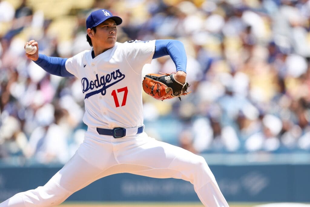 Jun 22, 2025; Los Angeles, California, USA; Los Angeles Dodgers two‑way player Shohei Ohtani (17) pitches the ball during the second inning against Washington Nationals at Dodger Stadium. Mandatory Credit: Kiyoshi Mio-Imagn Images