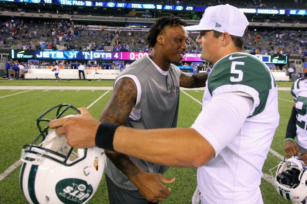 Aug 26, 2017; East Rutherford, NJ, USA; New York Giants wide receiver Brandon Marshall (15) hugs New York Jets quarterback Christian Hackenberg (5) after a preseason game at MetLife Stadium. Mandatory Credit: Brad Penner-USA TODAY Sports