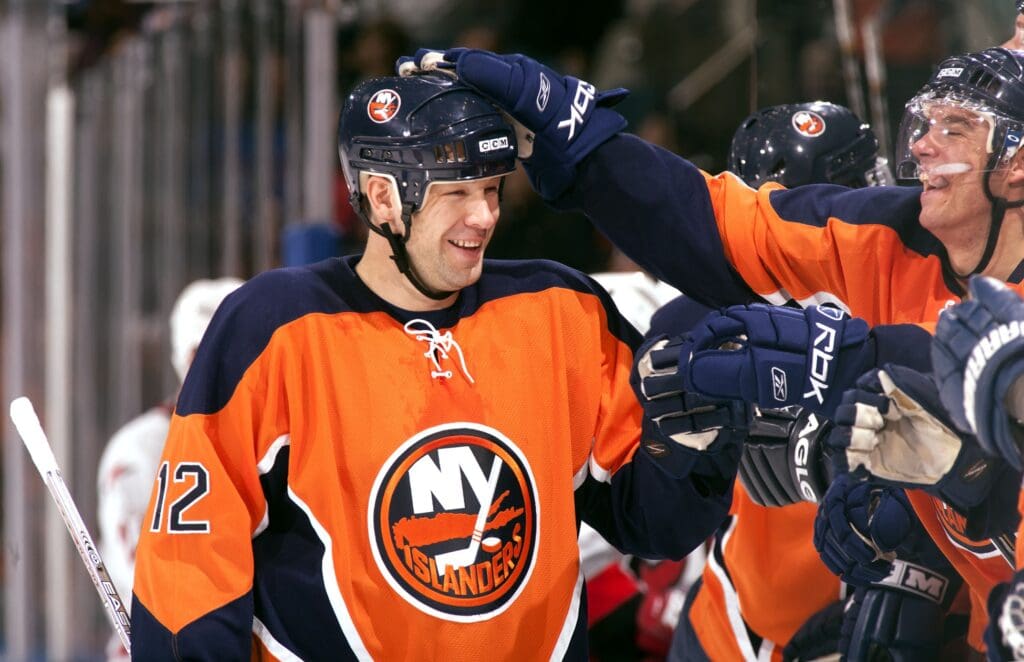 Oct 21, 2006; Uniondale, NY, USA; New York Islanders left wing Chris Simon (12) celebrates with teammates against the Carolina Hurricanes at Nassau Veterans Memorial Coliseum. Credit: Lou Capozzola-USA TODAY NETWORK