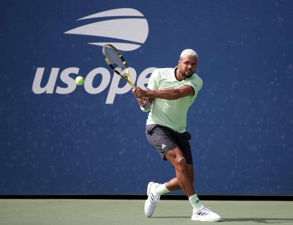 Aug 27, 2019; Flushing, NY, USA; Jo-Wilfried Tsonga of France hits to Tennys Sandgren of the United States in a first round match on day two of the 2019 U.S. Open tennis tournament at USTA Billie Jean King National Tennis Center. Mandatory Credit: Jerry Lai-USA TODAY Sports