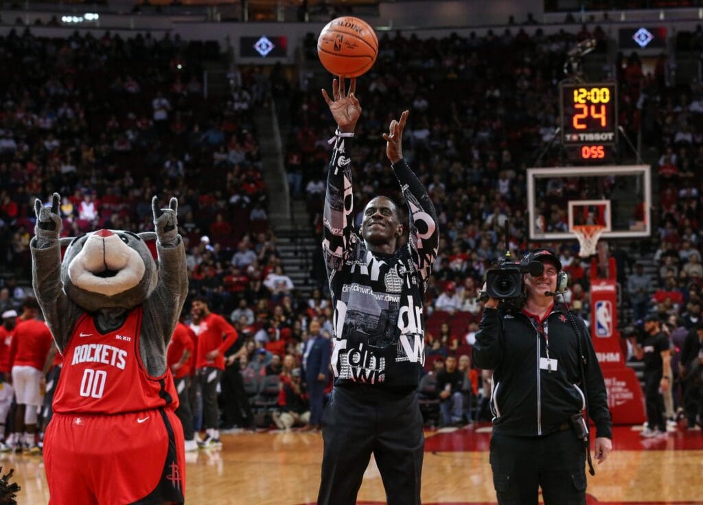 Feb 2, 2020; Houston, Texas, USA; Houston Rockets former player Vernon Maxwell shoots a ceremonial first shot before a game between the Houston Rockets and the New Orleans Pelicans at Toyota Center. Mandatory Credit: Troy Taormina-USA TODAY Sports