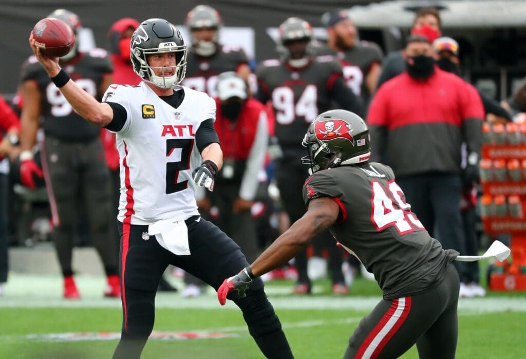 Jan 3, 2021; Tampa, Florida, USA; Atlanta Falcons quarterback Matt Ryan (2) throws the ball as Tampa Bay Buccaneers linebacker Cam Gill (49) pressures during the second half at Raymond James Stadium. Mandatory Credit: Kim Klement-USA TODAY Sports
