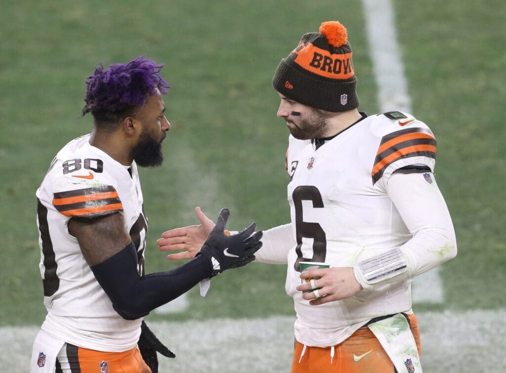 Jan 10, 2021; Pittsburgh, PA, USA; Cleveland Browns quarterback Baker Mayfield (6) celebrates with wide receiver Jarvis Landry (80) on the sideline against the Pittsburgh Steelers in the fourth quarter of an AFC Wild Card playoff game at Heinz Field. Mandatory Credit: Charles LeClaire-USA TODAY Sports