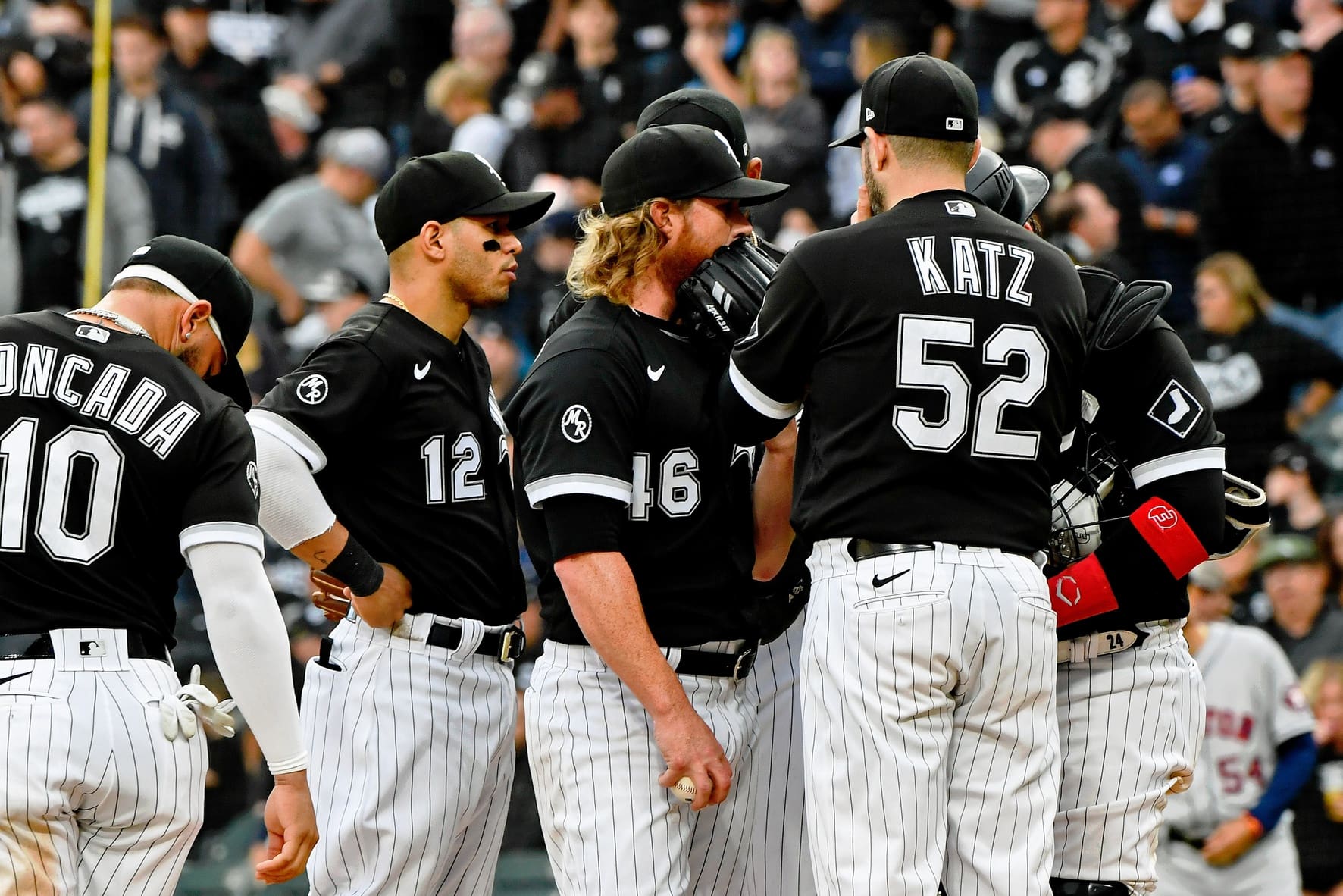 Oct 12, 2021; Chicago, Illinois, USA; Chicago White Sox relief pitcher Craig Kimbrel (46) talks with pitching coach Ethan Katz (52) between pitches during the eighth inning in game four of the 2021 ALDS against the Houston Astros at Guaranteed Rate Field. Mandatory Credit: Matt Marton-USA TODAY Sports