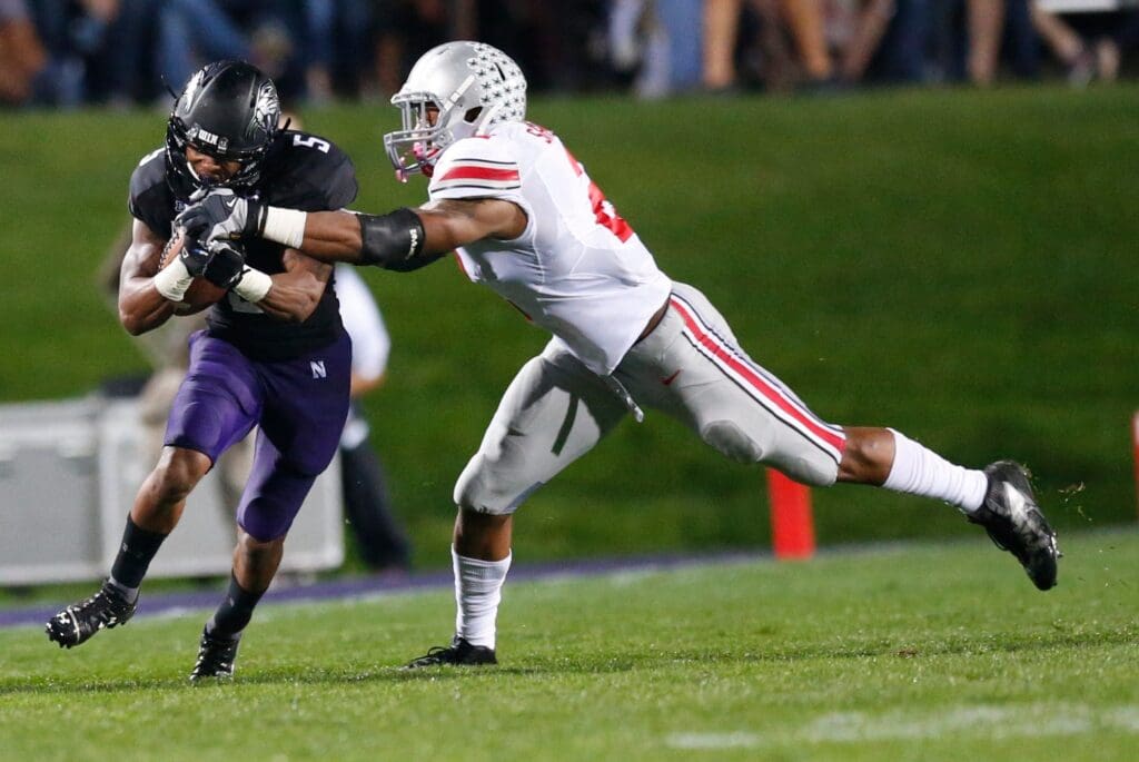 Northwestern Wildcats running back Venric Mark (5) is tackled by Ohio State Buckeyes linebacker Ryan Shazier (2) during Saturday's NCAA Division I football game at Ryan Field in Evanston on October 5 2013. (Barbara J. Perenic/The Columbus Dispatch)
Osu13wisc Bjp 07