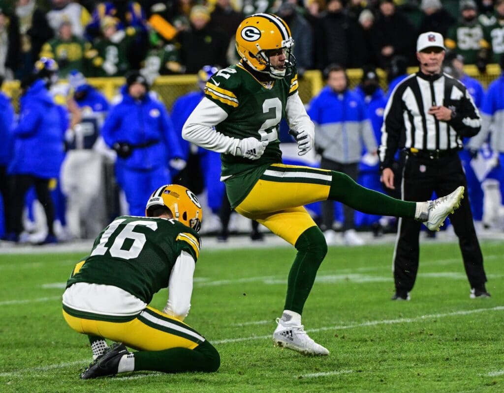 Dec 19, 2022; Green Bay, Wisconsin, USA; Green Bay Packers kicker Mason Crosby (2) kicks a field goalie the first quarter during game against the Los Angeles Rams at Lambeau Field. Mandatory Credit: Benny Sieu-USA TODAY Sports